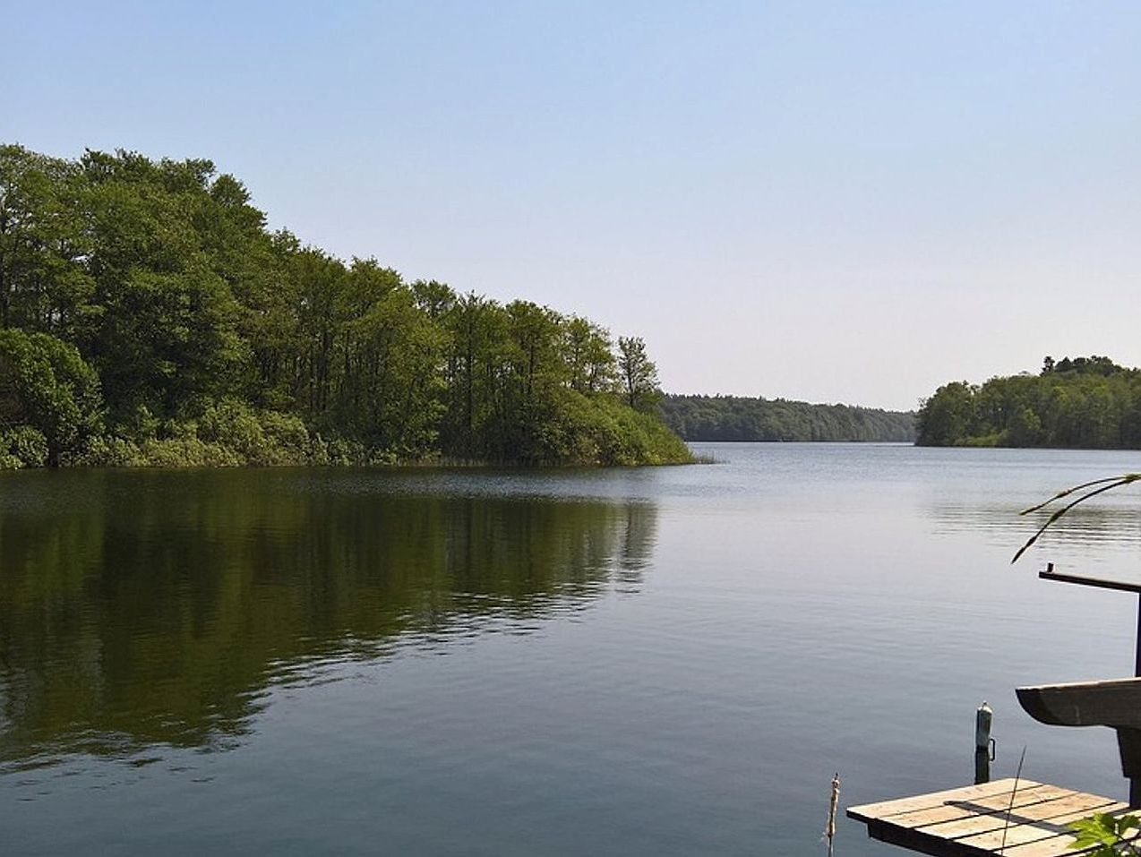 Open water stretching toward distant hills
